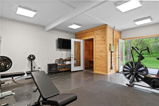 11155 Hubbard Rd, Kansas City, KS 66109 - workout area with wood walls and french doors