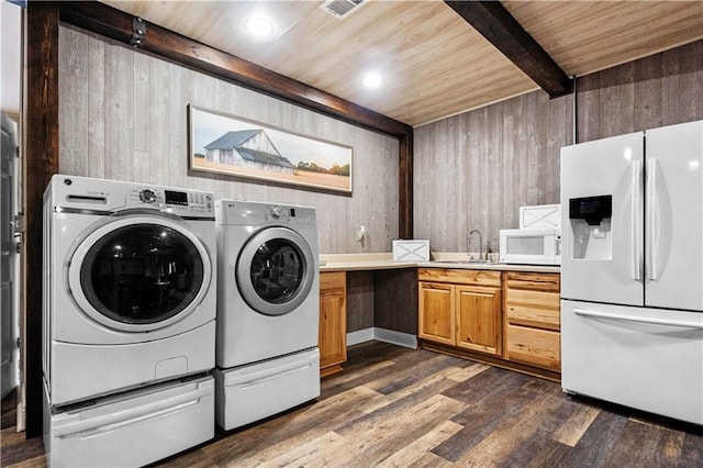 11155 Hubbard Rd, Kansas City, KS 66109 - washroom with washer and dryer, wooden ceiling, dark wood-type flooring, and wooden walls