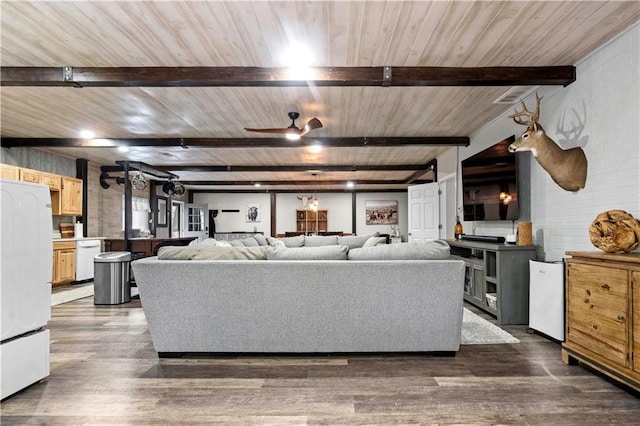 11155 Hubbard Rd, Kansas City, KS 66109 - living area with dark wood finished floors, wooden ceiling with exposed beams, and a ceiling fan