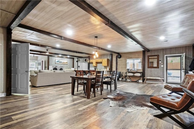 11155 Hubbard Rd, Kansas City, KS 66109 - dining space featuring wood finished floors, plenty of natural light, wooden ceiling with exposed beams, and recessed lighting