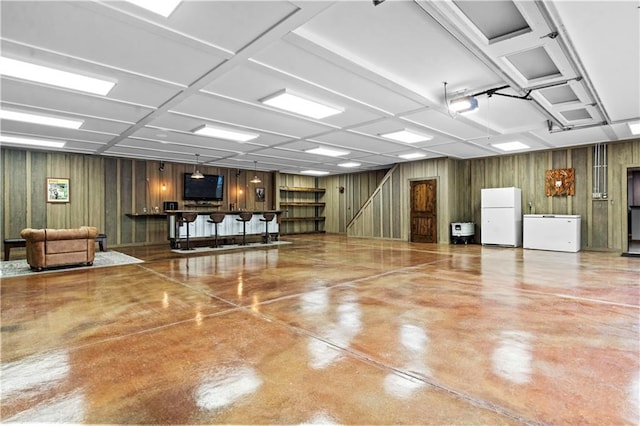 11155 Hubbard Rd, Kansas City, KS 66109 - misc room with finished concrete flooring and wooden walls