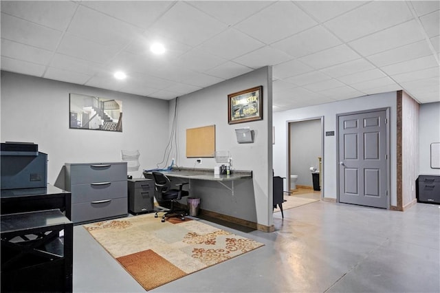 11155 Hubbard Rd, Kansas City, KS 66109 - office featuring concrete floors, baseboards, and a drop ceiling