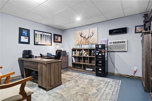 11155 Hubbard Rd, Kansas City, KS 66109 - home office with a drop ceiling, a wall mounted AC, and baseboards
