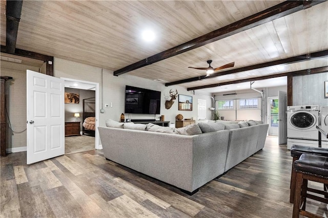 11155 Hubbard Rd, Kansas City, KS 66109 - living room with dark wood-type flooring, separate washer and dryer, a ceiling fan, and wooden ceiling with exposed beams