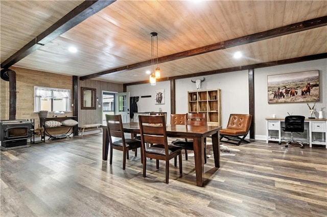11155 Hubbard Rd, Kansas City, KS 66109 - dining space featuring wood finished floors, a wood stove, baseboards, wooden ceiling with exposed beams, and recessed lighting