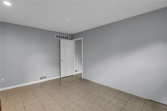 spare room featuring recessed lighting, baseboards, and visible vents