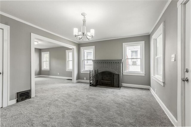 2219 E Meyer Blvd, Kansas City, MO 64132 - unfurnished living room with ornamental molding, carpet, a chandelier, baseboards, and a fireplace