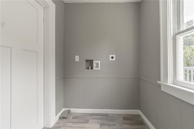 2219 E Meyer Blvd, Kansas City, MO 64132 - laundry area with hookup for an electric dryer, washer hookup, a wainscoted wall, wood finished floors, and baseboards