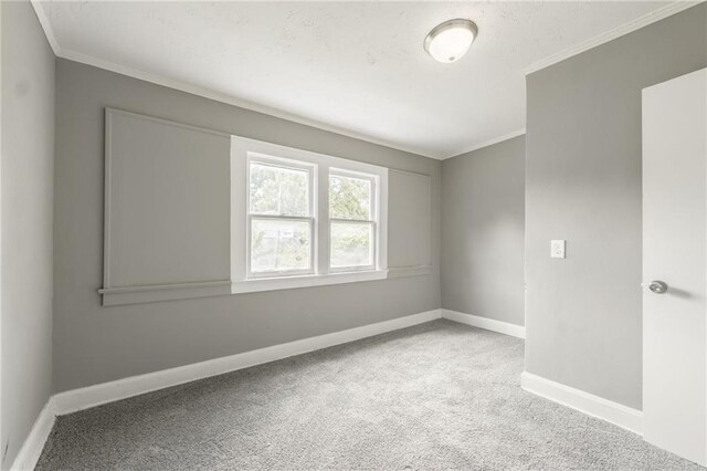 2219 E Meyer Blvd, Kansas City, MO 64132 - spare room with crown molding, carpet, and baseboards