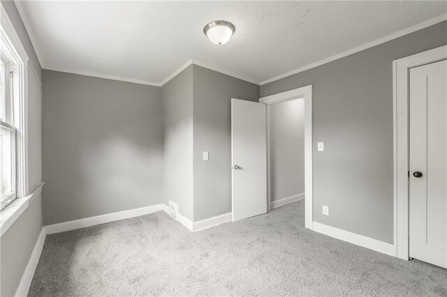 2219 E Meyer Blvd, Kansas City, MO 64132 - unfurnished bedroom with carpet, baseboards, and ornamental molding