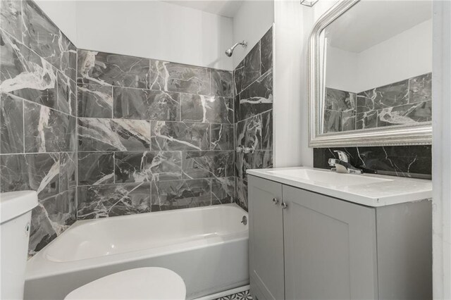2219 E Meyer Blvd, Kansas City, MO 64132 - full bath featuring toilet, vanity, and shower / bathtub combination