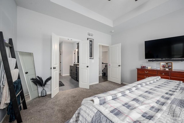 carpeted bedroom with baseboards and visible vents