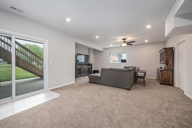living area with a ceiling fan, light colored carpet, baseboards, visible vents, and recessed lighting