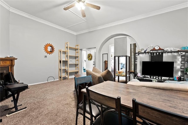 510 E Park St, Olathe, KS 66061 - carpeted dining area featuring arched walkways, crown molding, and ceiling fan