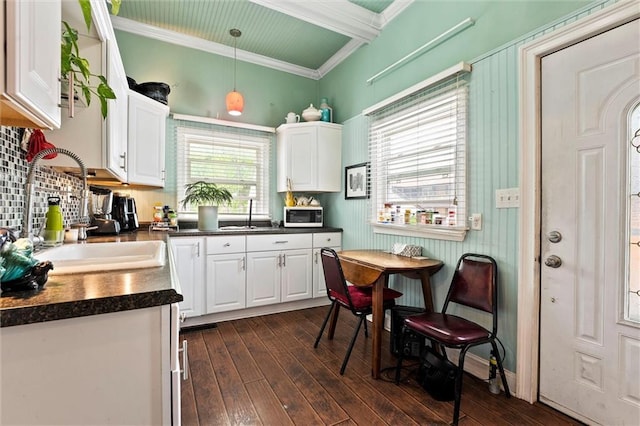 510 E Park St, Olathe, KS 66061 - kitchen with white cabinetry, dark countertops, dark wood-type flooring, and ornamental molding