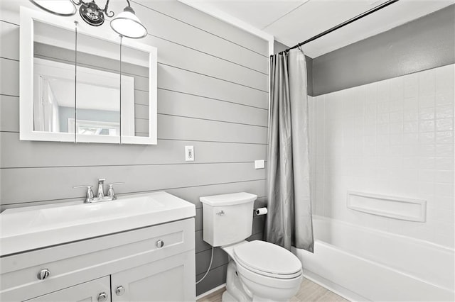 510 E Park St, Olathe, KS 66061 - full bath featuring vanity, shower / bathtub combination with curtain, and wood finished floors