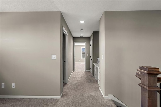 21410 W 189th Ter, Spring Hill, KS 66083 - hall featuring light carpet, baseboards, an upstairs landing, and recessed lighting