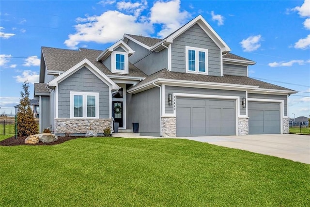 21410 W 189th Ter, Spring Hill, KS 66083 - view of front of house featuring stone siding, concrete driveway, a garage, and roof with shingles