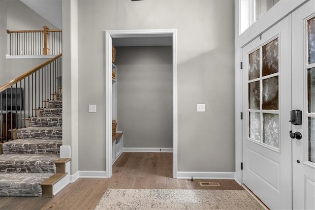 21410 W 189th Ter, Spring Hill, KS 66083 - entrance foyer featuring wood finished floors, baseboards, and stairway
