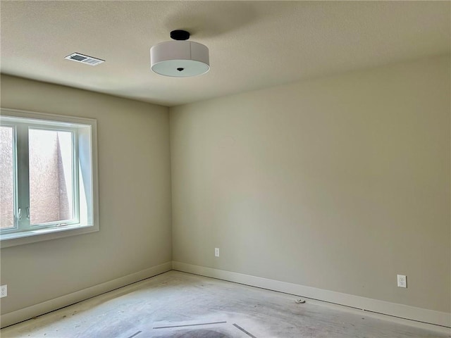 10303 W 151st Ter, Overland Park, KS 66221 - spare room with concrete floors and a textured ceiling