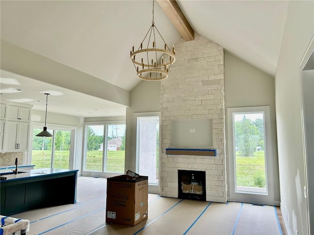 10303 W 151st Ter, Overland Park, KS 66221 - living room featuring a chandelier, beamed ceiling, a brick fireplace, healthy amount of natural light, and high vaulted ceiling