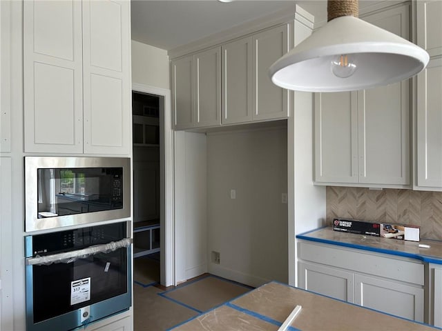 10303 W 151st Ter, Overland Park, KS 66221 - kitchen featuring stainless steel oven, black microwave, and tasteful backsplash