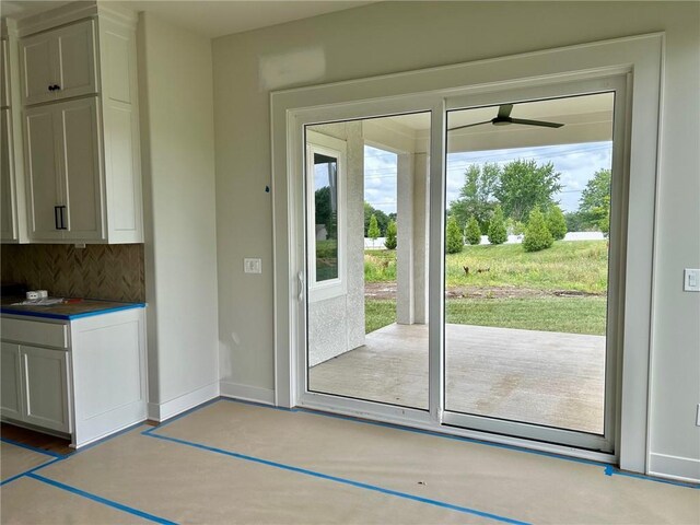 10303 W 151st Ter, Overland Park, KS 66221 - doorway to outside featuring ceiling fan and baseboards