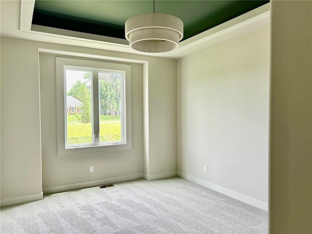 10303 W 151st Ter, Overland Park, KS 66221 - carpeted spare room with healthy amount of natural light and a tray ceiling