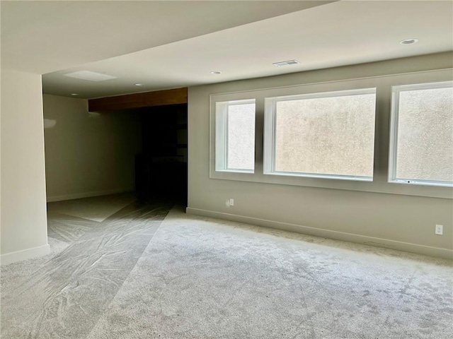 10303 W 151st Ter, Overland Park, KS 66221 - unfurnished living room featuring baseboards and carpet