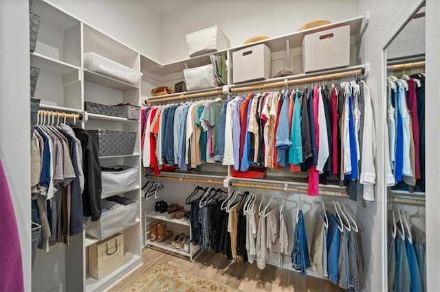 spacious closet with wood finished floors