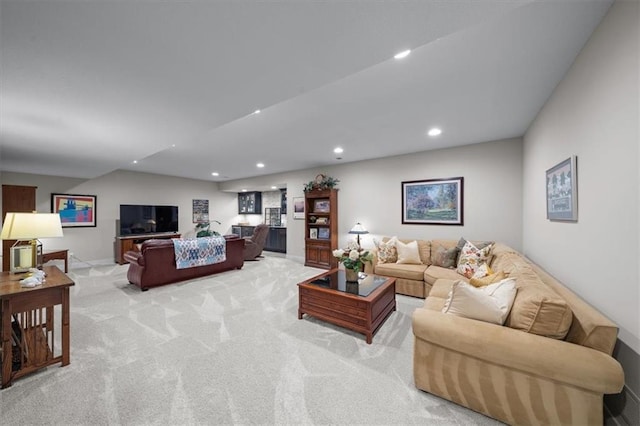living area with light colored carpet, recessed lighting, and baseboards