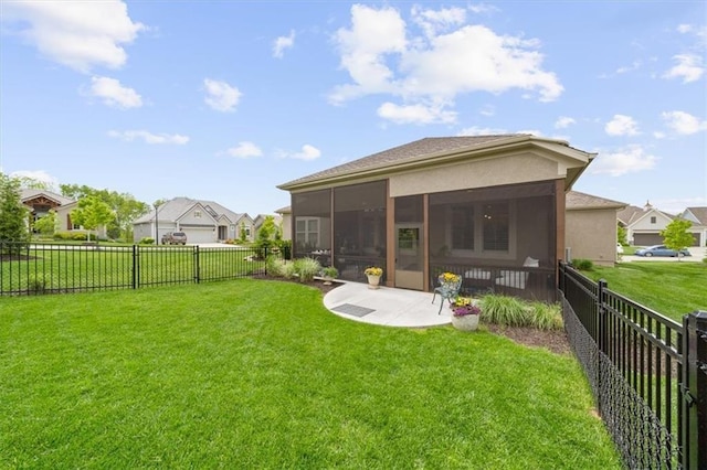 back of property with a sunroom, stucco siding, a patio, and a residential view