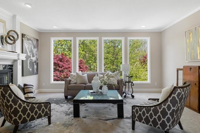 carpeted living area with baseboards, ornamental molding, plenty of natural light, and recessed lighting