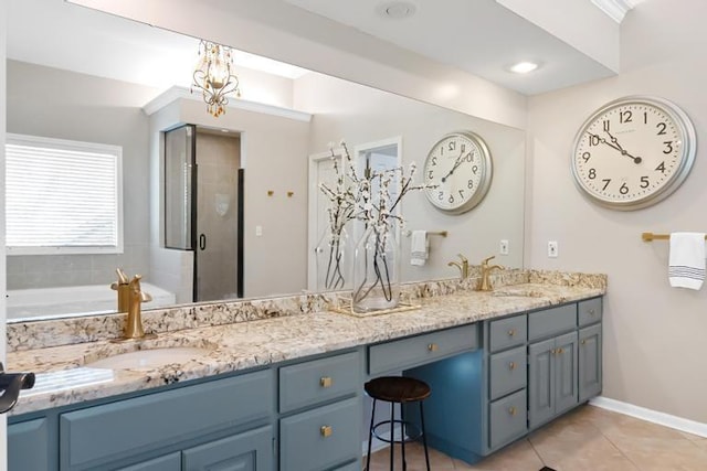 bathroom with double vanity, a sink, tile patterned floors, and a stall shower