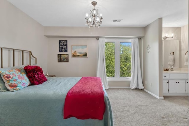 bedroom featuring light colored carpet, a notable chandelier, ensuite bath, baseboards, and visible vents