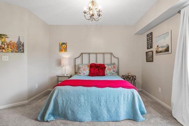 carpeted bedroom featuring an inviting chandelier and baseboards