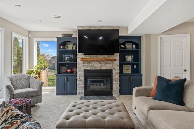 carpeted living room featuring a fireplace