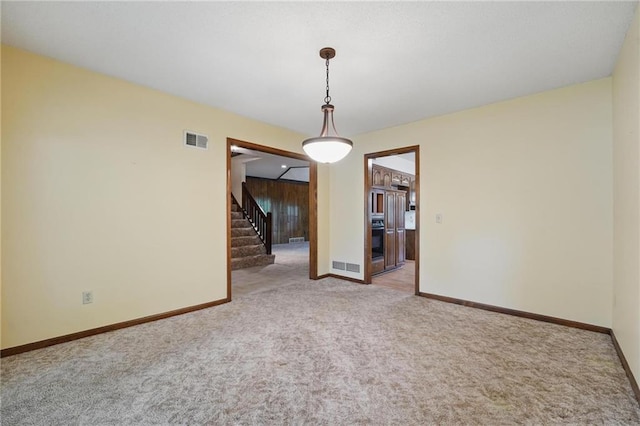 10503 W 50th Ter, Shawnee, KS 66203 - carpeted empty room with stairway and baseboards