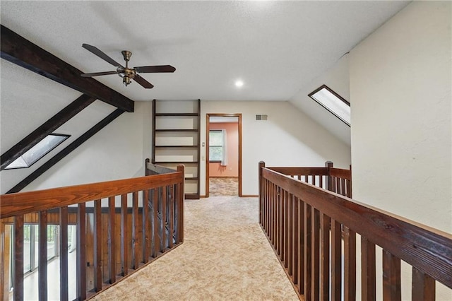 10503 W 50th Ter, Shawnee, KS 66203 - hallway with a skylight, carpet floors, vaulted ceiling, healthy amount of natural light, and an upstairs landing