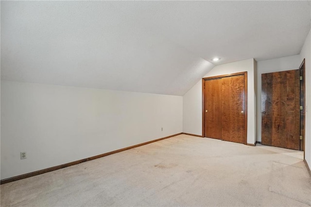 10503 W 50th Ter, Shawnee, KS 66203 - additional living space with carpet floors, lofted ceiling, and baseboards