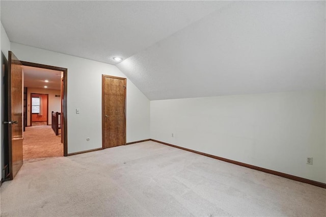 10503 W 50th Ter, Shawnee, KS 66203 - bonus room featuring light carpet, lofted ceiling, and baseboards