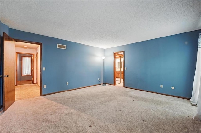 10503 W 50th Ter, Shawnee, KS 66203 - empty room with carpet floors, a textured ceiling, and baseboards