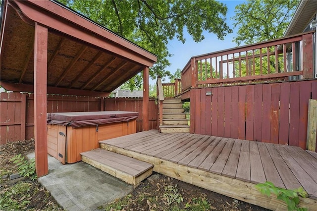 10503 W 50th Ter, Shawnee, KS 66203 - deck featuring a hot tub, stairs, and a fenced backyard