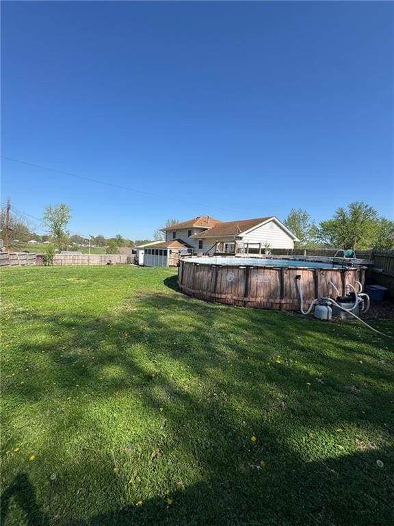 166 Crescent Dr, Chillicothe, MO 64601 - view of yard with fence and an outdoor pool