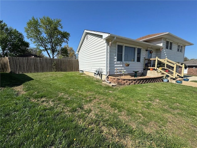 166 Crescent Dr, Chillicothe, MO 64601 - view of side of home featuring a lawn and fence