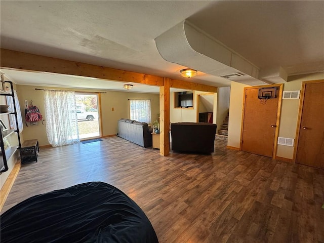 166 Crescent Dr, Chillicothe, MO 64601 - living room featuring wood finished floors, visible vents, and stairway