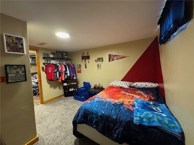166 Crescent Dr, Chillicothe, MO 64601 - carpeted bedroom with baseboards and visible vents