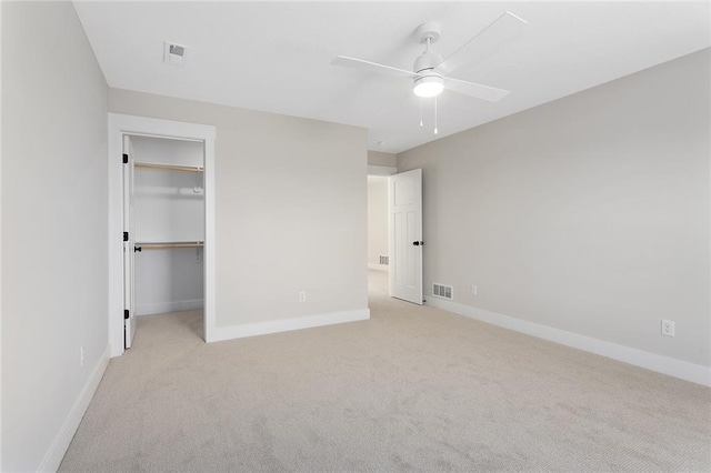 unfurnished bedroom featuring light carpet, baseboards, and visible vents