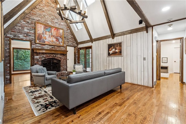 4710 Monrovia St, Shawnee, KS 66216 - living area with high vaulted ceiling, light wood-type flooring, beam ceiling, and a brick fireplace
