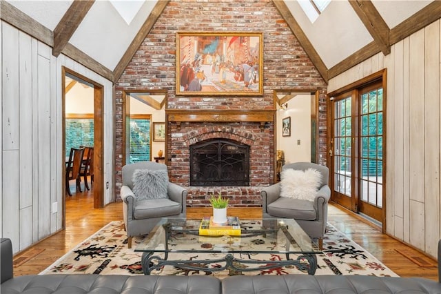 4710 Monrovia St, Shawnee, KS 66216 - living room featuring a skylight, high vaulted ceiling, wood finished floors, beamed ceiling, and a fireplace